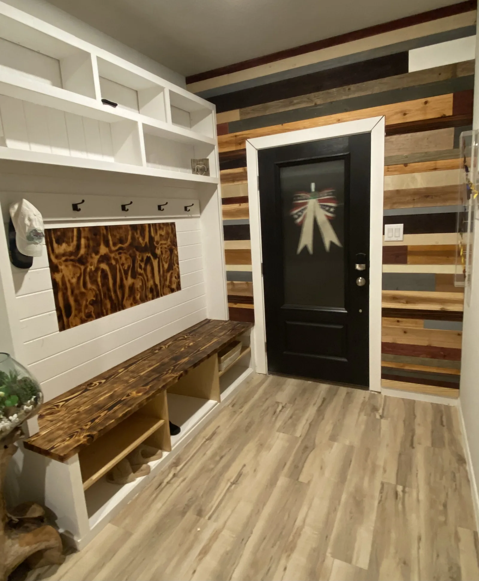 Mudroom lockers with a solid wood bench and board and batten panelling